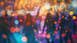 A blurry dancing silhouettes of a crowd of people. Neon lights and bokeh effect background. Nightlife and disco concept.