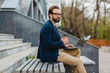 Wall Mural - handsome busy bearded man working in park