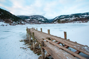 Wall Mural - Beautiful view of windmills around Lake Çubuk, located in Bolu - Goynuk district of Turkey. Photo of mills in snowy weather in winter.