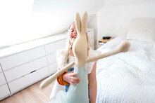 Young Girl Dancing In Her Room Hugging Her Favourite Soft Toy. Bunny Rabbit
