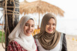 © Connect Images - Portrait of two young muslim women in a coastal town in southern Thailand