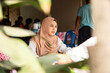 © Connect Images - Two young women one wearing a Hijab   sitting together in a cafe restaurant in a rural town in Thailand
