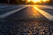 closeup of asphalt with traffic lines during sunrise