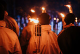 Fototapeta  - Crowd holding torches in night