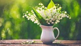 Fototapeta Kwiaty - beautiful spring lily of the valley in vase colorful artistic image with a soft focus green bokeh background