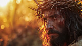 Fototapeta Koty - retrato de Jesucristo con mirada intensa portando la cruz de espinas con la cara ensangrentada, sobre fondo dorado bokeh