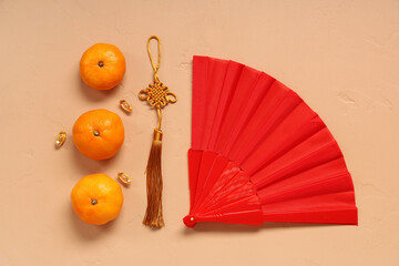 Wall Mural - Mandarins and Chinese symbols on beige background. New Year celebration