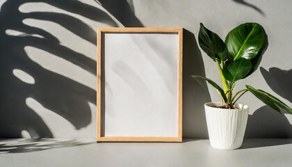 enhancing the mockup overlay in a horizontal, two vertical sheets of textured white paper against a soft gray table background. the natural light creates subtle shadows from an with leaves on table