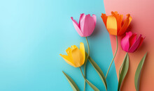 Paper Crafted Tulips On Dual Tone Blue And Coral Pastel Background