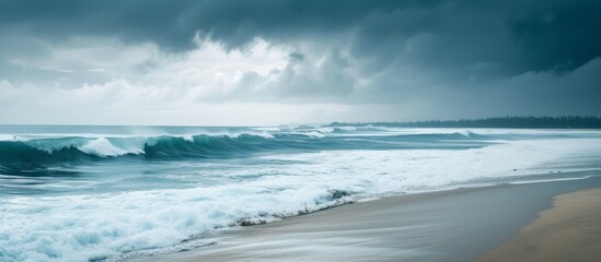 Wall Mural - Majestic large wave rolling in on the sandy shore of a beautiful beach