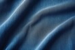 A close up view of a blue fabric. This versatile image can be used in various creative projects