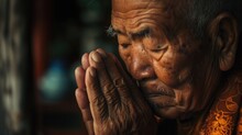 An Old Man With A Concerned Expression Clasps His Hands Together. This Image Can Be Used To Depict Worry, Stress, Anxiety, Or Prayer