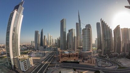 Wall Mural - Aerial panorama of Dubai Downtown skyline with many towers night to day timelapse.