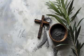 Wall Mural - Ash Wednesday,faith, liturgy, religious ceremony background. Wooden cross, ceremonial dish with ash and olive leaf branch on gray background. Top view