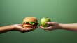 Unhealthy vs healthy food. Burger and apple in different hands on green background . Choice between fast foods and vegetables, fruit. AI Generative