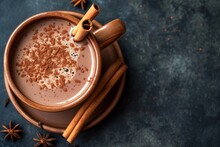 Top View Of A Square Image Showing A Vintage Mug Of Hot Chocolate With Cinnamon Sticks On A Dark Background
