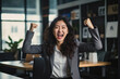 © Kitta Studio - Korean woman laughing with showing victory with joy with a fist pump in the air