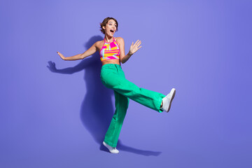 Poster - Full length photo of overjoyed lovely girl wear bright outfit celebrate festive event look empty space isolated on purple color background