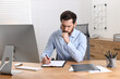 © New Africa - Sick man coughing at workplace in office. Cold symptoms