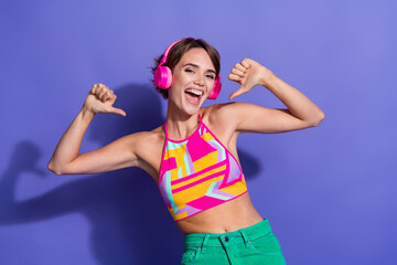 Poster - Photo of young overjoyed funny lady in bright pink crop top point fingers herself summertime party dj isolated on violet color background