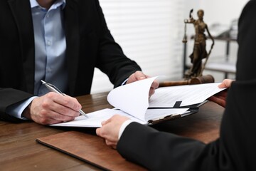 Poster - Man signing document in lawyer's office, closeup