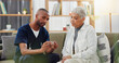 © Wesley/peopleimages.com - Caregiver, patient and pills, instructions and help for treatment dosage, medicine and elderly care. Pharmaceutical drugs, advice and African nurse with old woman on sofa and supplements for health