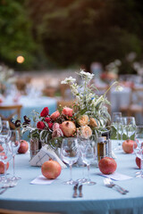 Wall Mural - Set table at a wedding reception with floral centerpiece and candles