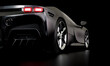matt black luxury sports car, rear view, copyspace, dark background.
