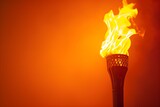 Fototapeta  - Fiery Blaze of the Olympic Torch Against a Dramatic Ember Background Signifying the Spirit of International Sportsmanship