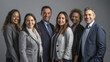 © MP Studio - diverse group of business professionals smiling and posing for a group photo, likely representing a collaborative and inclusive corporate team.