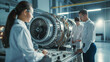 © colnihko - Team of engineers working on high-tech turbine engine in an industrial setting