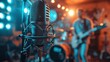 Professional recording microphone in focus with a live band performing in the background, set in a studio with vibrant stage lighting.