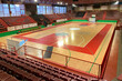 empty sports hall with wooden floor and bleachers
