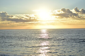 Wall Mural - Pelicans over the waves off the coast in the Sunrise in Los cabos, Mexico