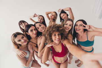 Canvas Print - No filter studio photo of shiny funny women wear underwear showing v-sing tacking selfie enjoying girls power isolated beige color wall background