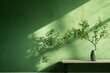 Green branch tree with shadow on green wall background with copy space