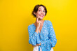 Photo of funky dreamy young woman wear flower print blouse finger chin looking empty space isolated yellow color background