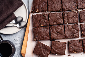 Wall Mural - Chocolate brownie cake with cream cheese on wooden board