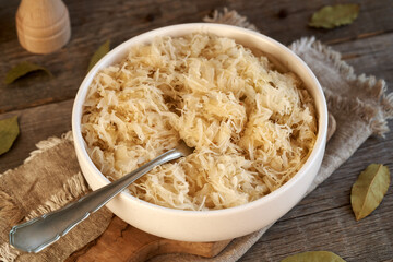 Wall Mural - Fermented sauerkraut in a white bowl