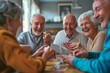 © AAA - senior men and ladies playing with cards for the first time