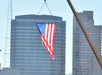 Sticker - American Flag on a Hoist in a City