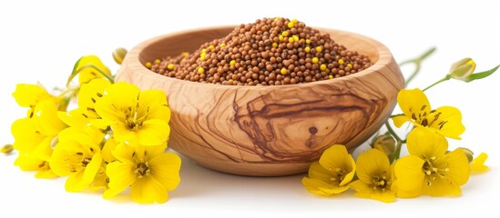 Sticker - Yellow flower and mustard seeds in a wooden bowl, isolated on a white background.