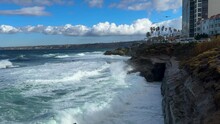 King Tide At La Jolla Cove Skyline View Over Waves Crashing On Clliffs Birds Flying By..