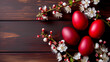 Easter eggs with flowers on a wooden table