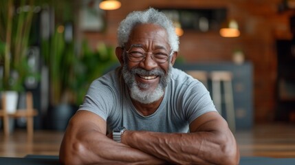 An older gentleman beaming with joy as he completes a challenging plank exercise in a virtual fitness class surrounded by his supportive online classmates.