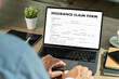 © onephoto - Insurance claim form on computer Document Application