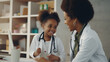 © wiparat - Friendly doctor doing medical checkup child