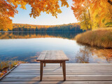 Fototapeta Pomosty - Wooden table on the lake in autumn forest. Nature composition.