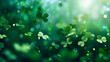 Green clover leaves on bokeh background with sunbeams