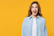 Young shocked exultant fun surprised excited woman she wear blue shirt white t-shirt casual clothes look aside on workspace area isolated on plain yellow background studio portrait. Lifestyle concept.
